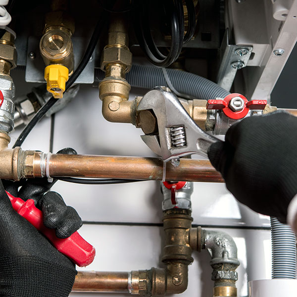 plumber adjusting pipes